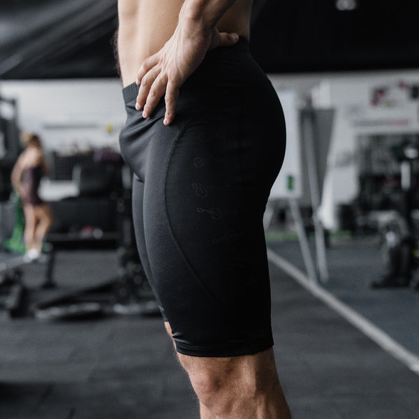 Person wearing black Men's Compression Shorts X-Edition - Warm Body Cold Mind