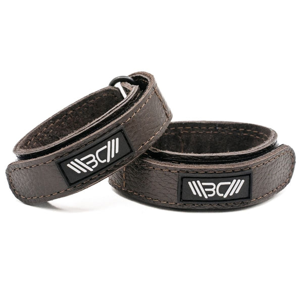 Two Brown Basic Leather Wrist Wraps with visible branding on a white background - Warm Body Cold Mind
