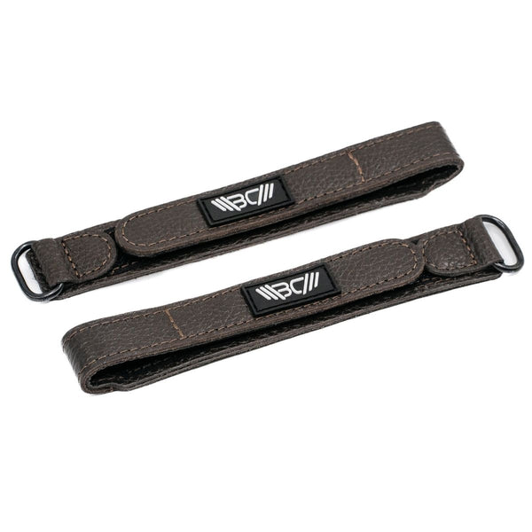 Two Brown Basic Leather Wrist Wraps with visible branding on a white background - Warm Body Cold Mind