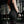 Person with tattoos wearing black WOMENS WEIGHTLIFTING COMPRESSION SINGLET S-3 with visible branding in an indoor setting (Back view) - Warm Body Cold Mind